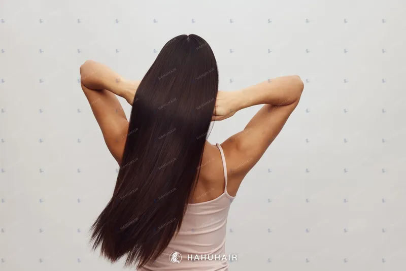 Long, straight, glossy dark brown-black hair seen from behind
