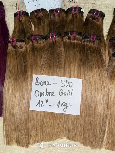 Bone straight ombre gold blond hair wefts with handwritten length and grade labels