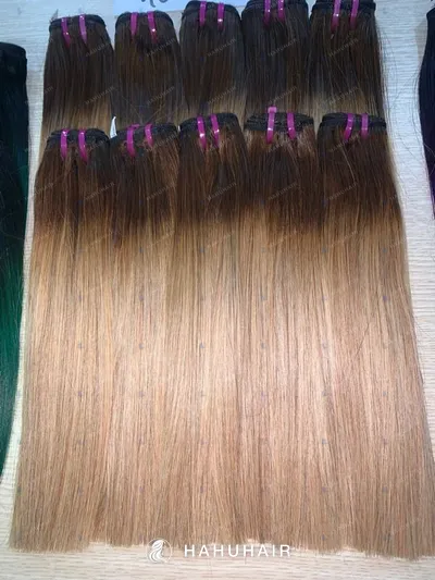 Bone straight ombre gold blond hair wefts with handwritten length and grade labels