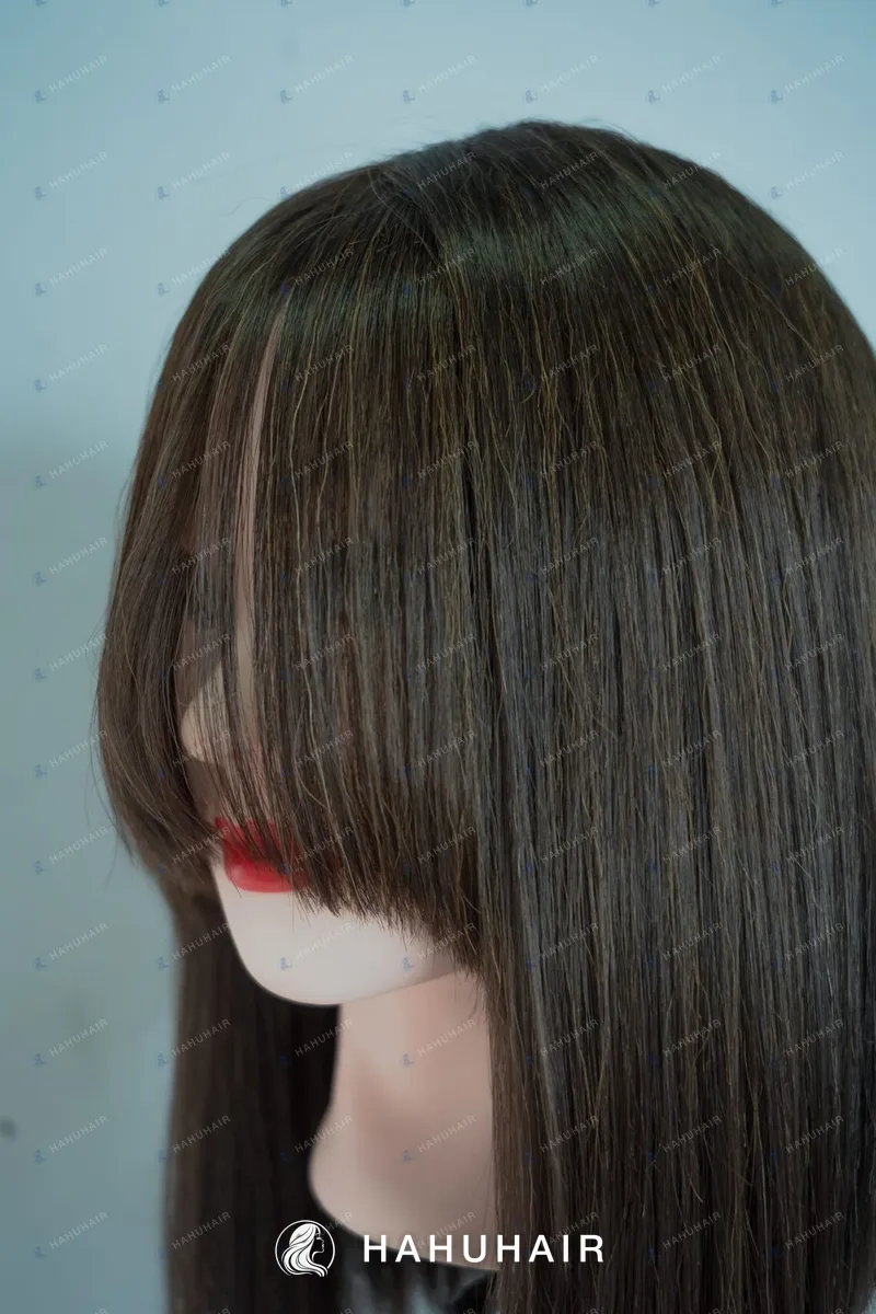 Long straight dark brown hair with a fringe on a mannequin head
