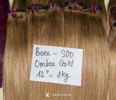 Bone straight ombre gold blond hair wefts with handwritten length and grade labels